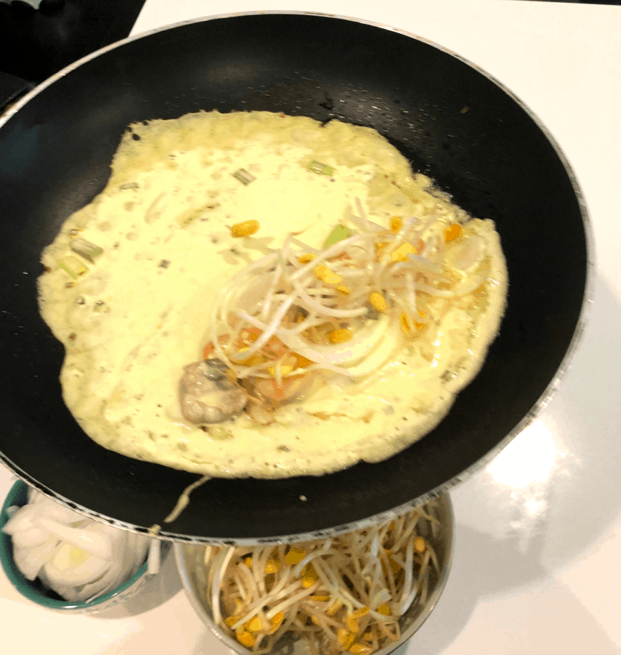 Adding the vegetables for the crepes