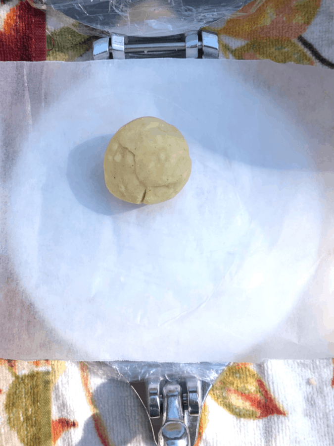tortilla ball on press