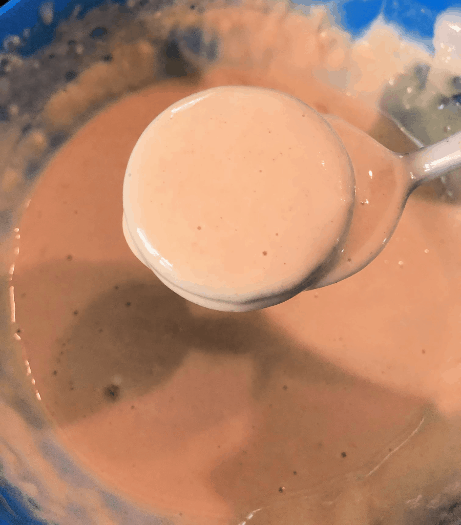 dipping oreos into the batter